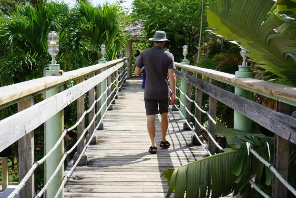 man walks on a boardwalk at Hedonism II resort